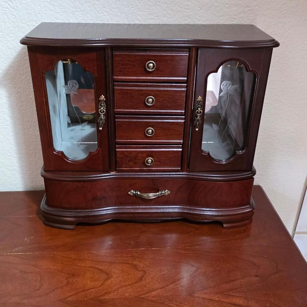 Brown Wooden jewelry cabinet with glass doors and drawers